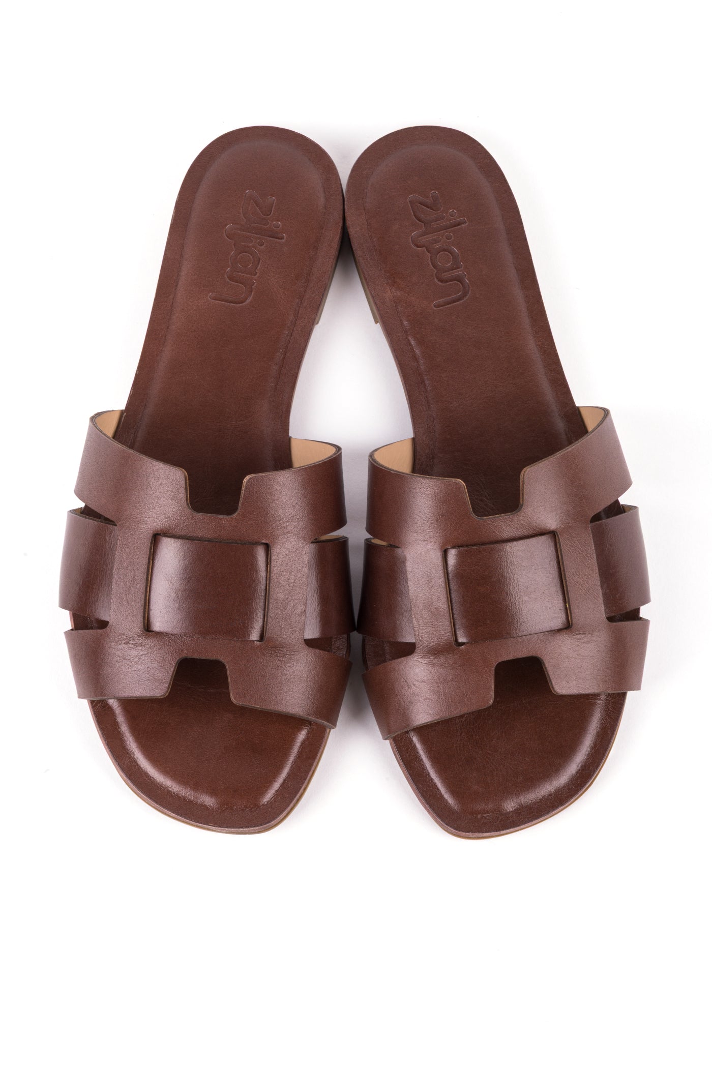 Sandálias rasas em pele