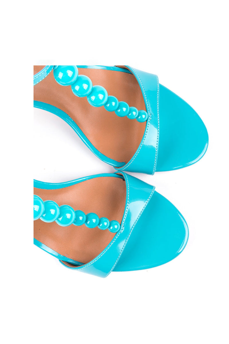 ​High-heeled t-bar sandals in blue varnish leather