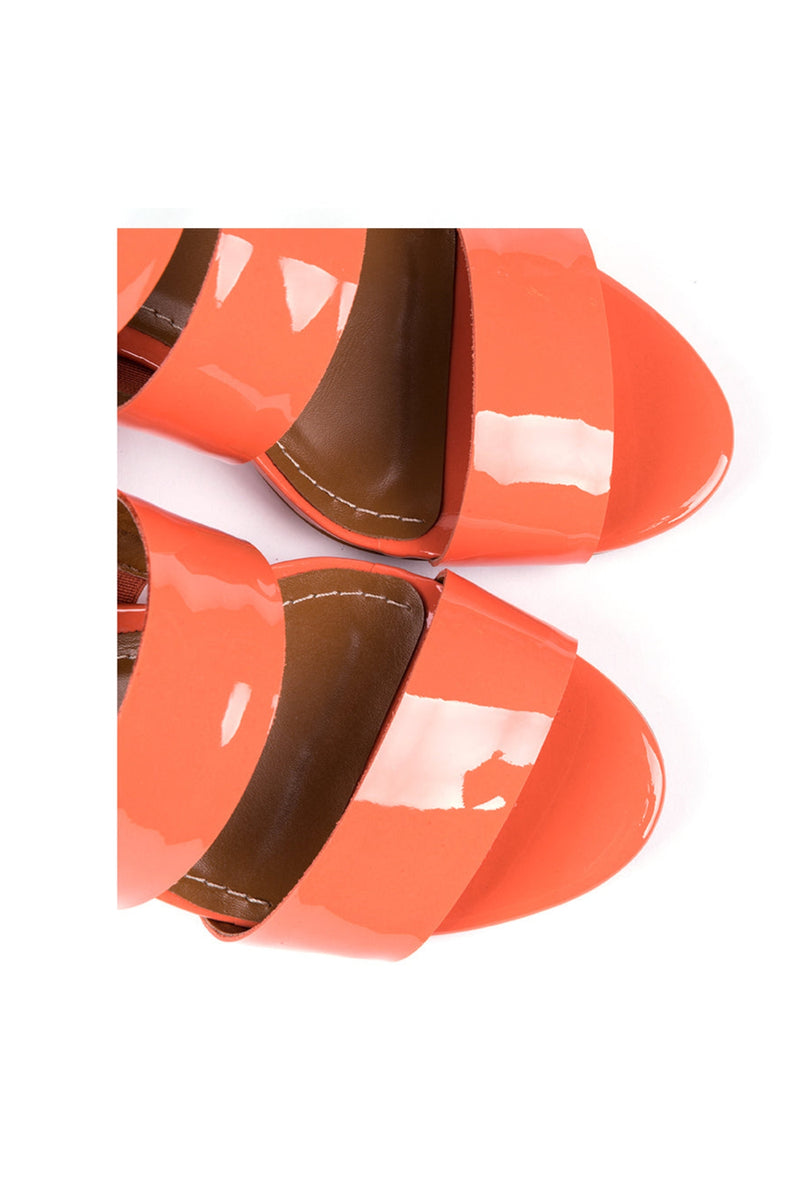 ​High-heeled sandals in orange varnish leather