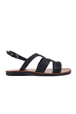 Flat sandals in black raffia