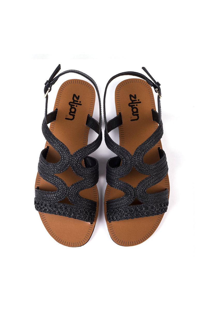 Flat sandals in black raffia