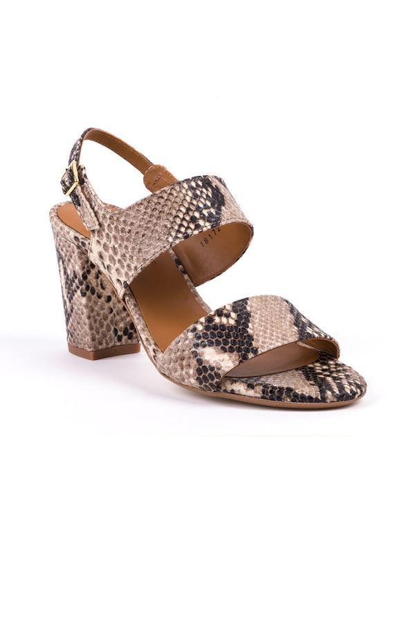 High-heeled sandals in natural patterned leather