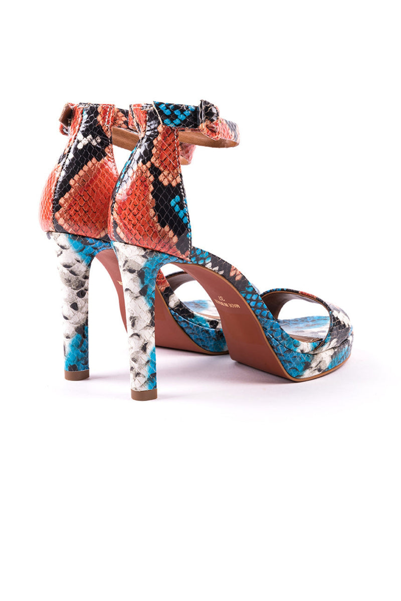 High-heeled sandals in snake print engraved leather