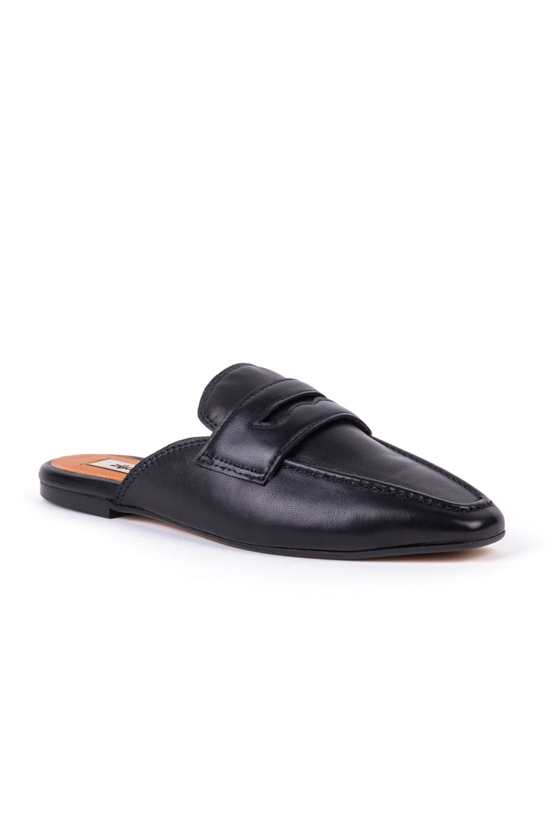 Mules rasas estilo loafer em pele