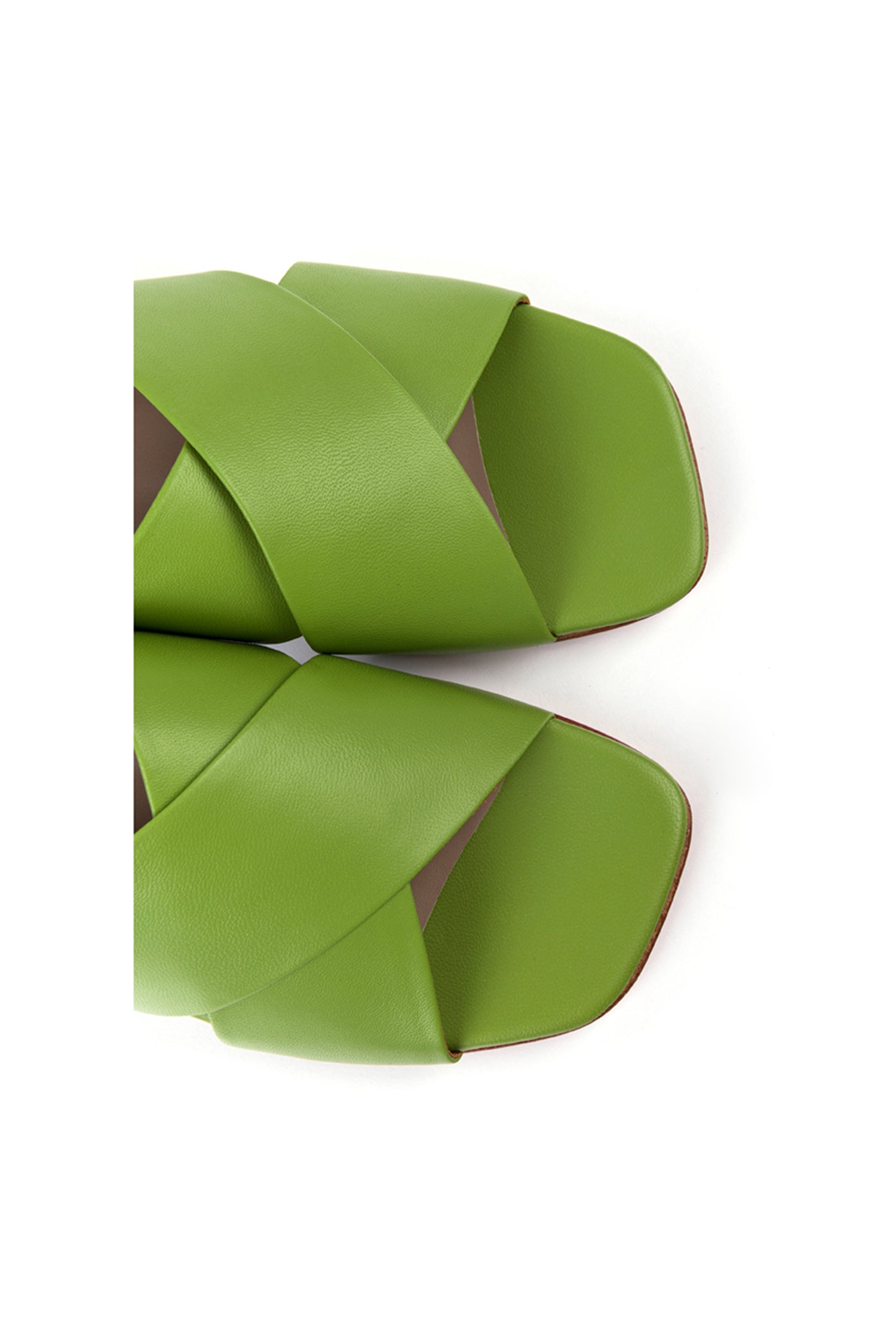 Flat mules in green leather