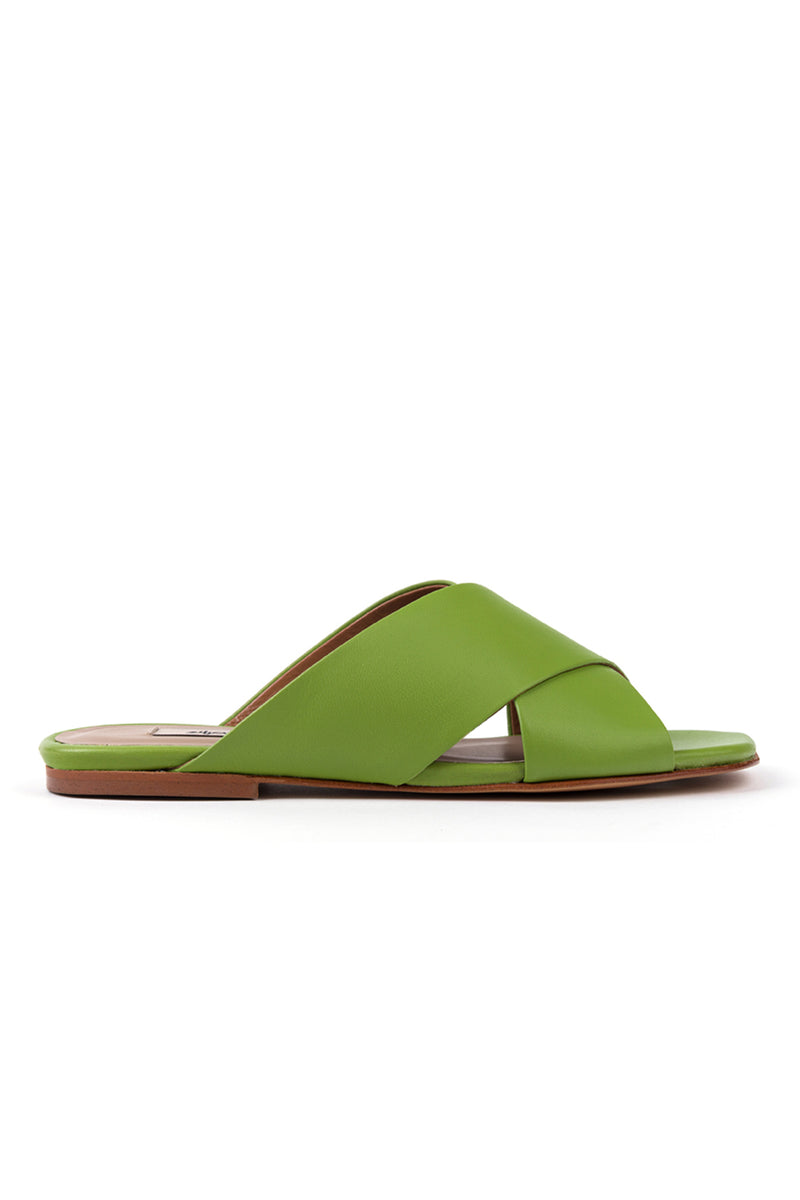 Flat mules in green leather