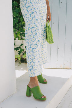 High heeled mules in green leather