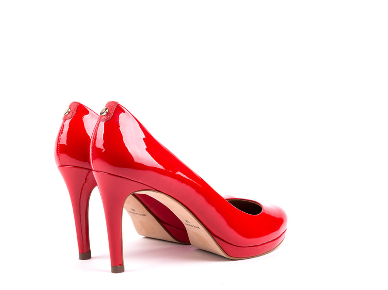 ​High-heeled shoes in varnish red leather