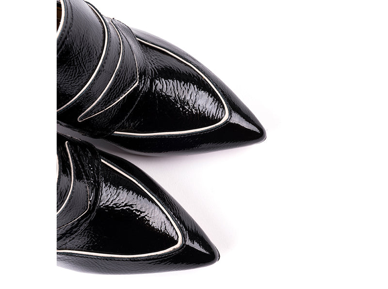 ​High-heeled shoes in black varnished leather