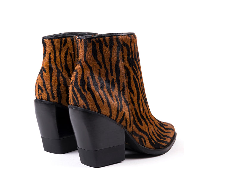 High heeled ankle boots with zebra printed fur