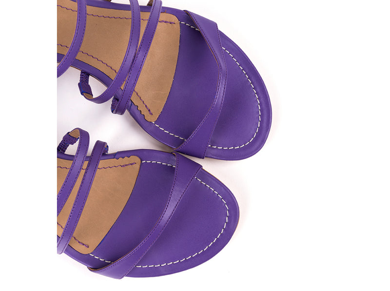 Flat sandals in purple leather