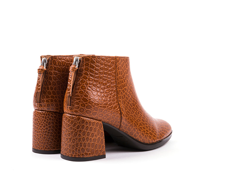 High-heeled ankle boots in camel embossed leather