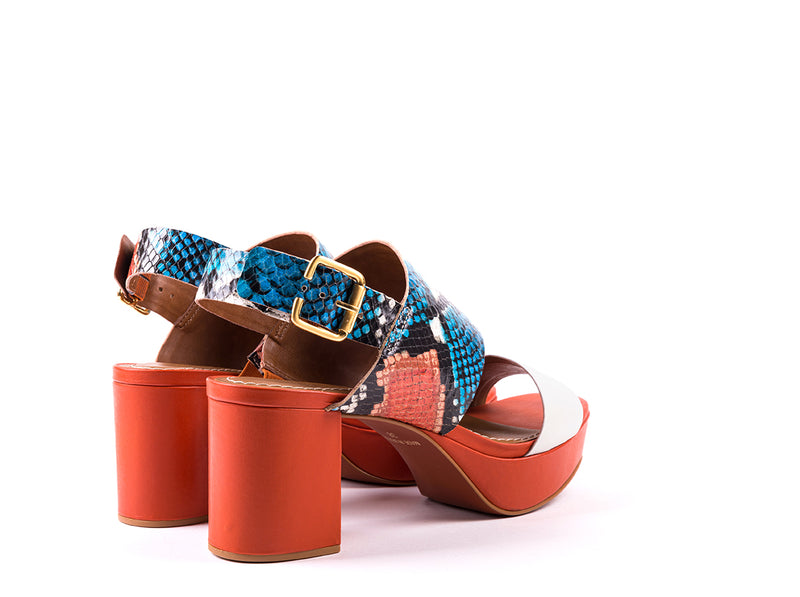 ​High-heeled sandals in orange and snake pattern engraved leather