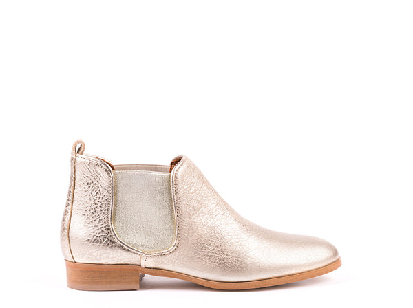 ​Flat ankle boots in rustic golden leather