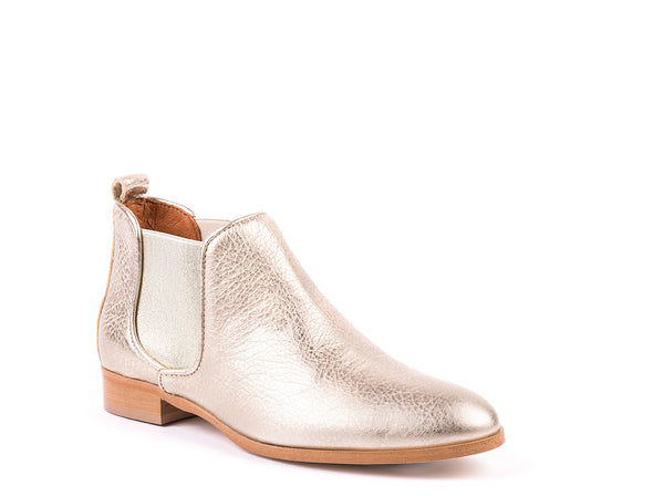 ​Flat ankle boots in rustic golden leather