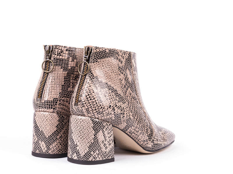 ​High-heeled ankle boots in engraved leather