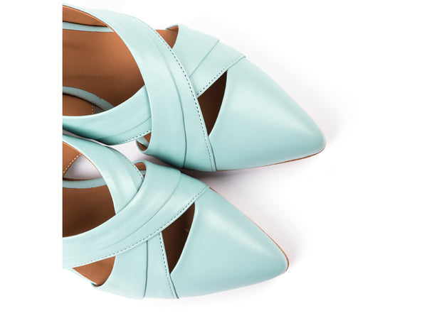 Flat slingbacks in light green leather